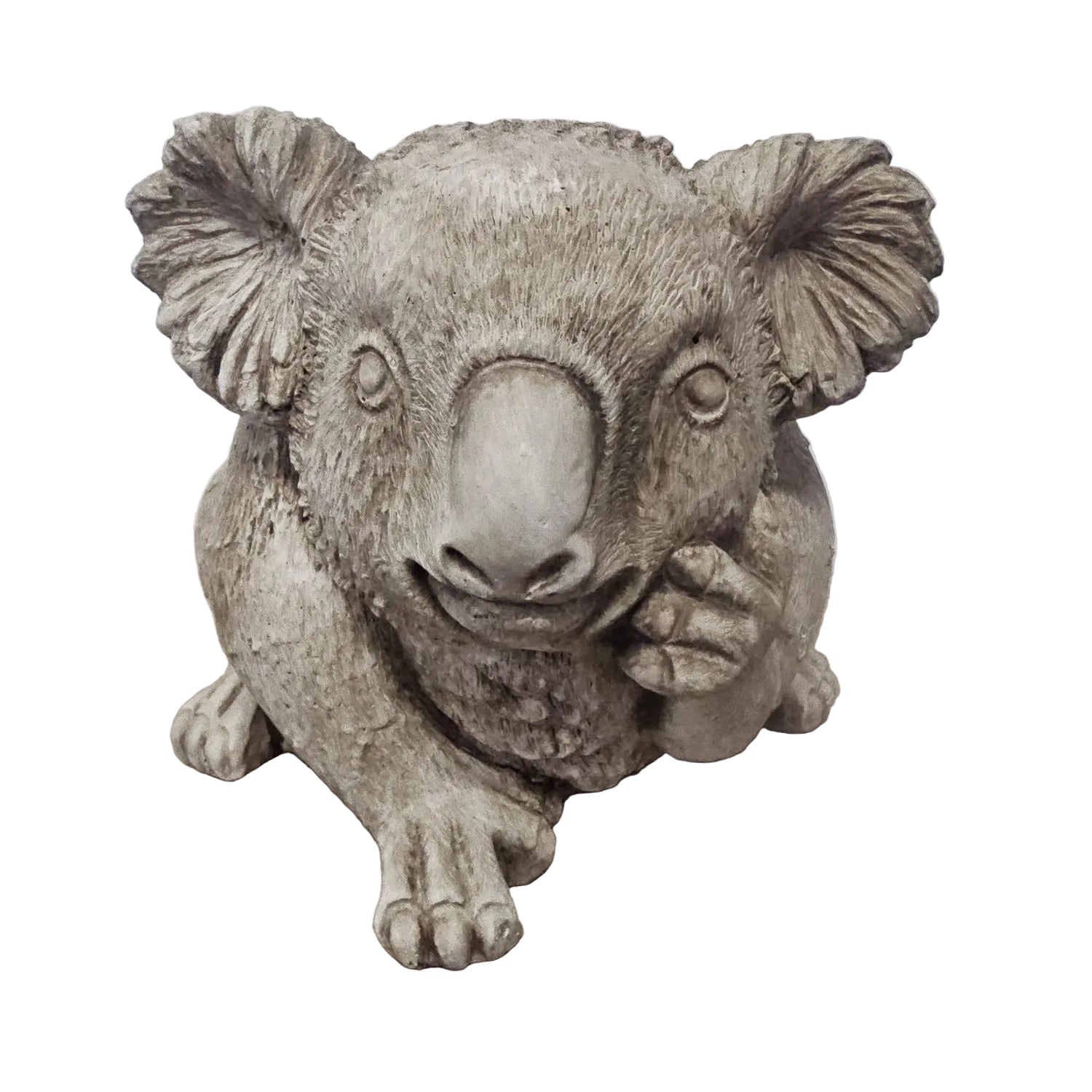 A realistic gray koala figurine sitting on a light wood surface against a plain light gray wall.