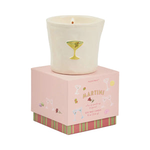 Candle in a decorative pink box with 'Martini' text and cocktail illustrations on a white background.