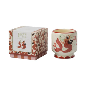 Mermaid-themed candle with matching packaging on a white background